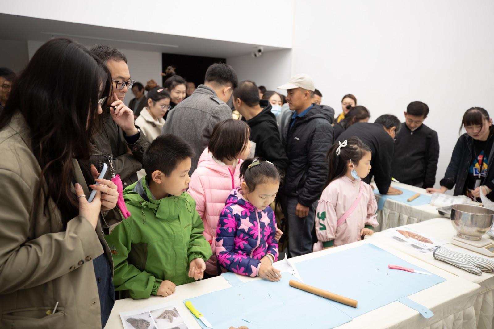 04 Exhibition View, Audiences and Bread Hands.jpg