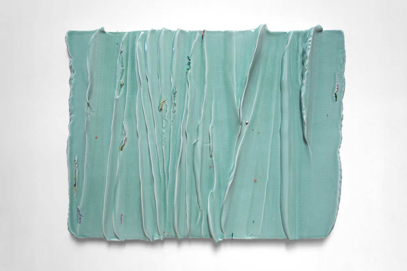 Yin Xiuzhen, Wall Instrument -The Surging Waves Chronicles Vol.3, (2019–2021). Porcelain, used clothes. 98 cm × 122 cm × 10 cm. © Yin Xiuzhen. Courtesy Pace Gallery..jpeg