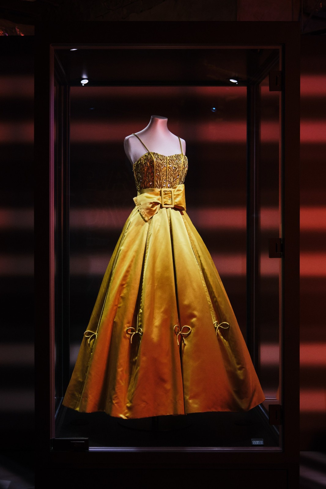 A golden yellow silk satin evening gown with a full skirt designed by Owen Hyde-Clark for Worth London. Photo by K11 Musea.jpg