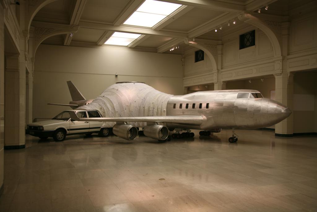 Installation view of YIN XIUZHEN’s Flying Machine, 2008, used clothes, stainless steel, planks, car, tractor, 353 × 1592 × 1220 cm, at the 7th Shanghai Biennale Translocalmotion, 2008, Shanghai Art Museum. Courtesy the artist..jpeg